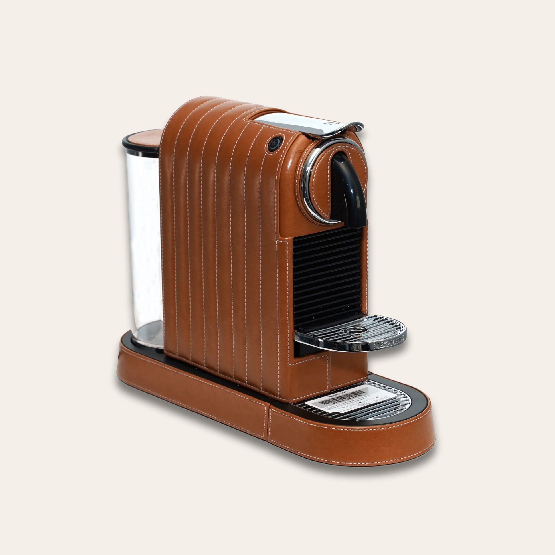 Stylish Citiz Nespresso coffee machine wrapped in a shiny brown vegan leather with a for an elegant living space