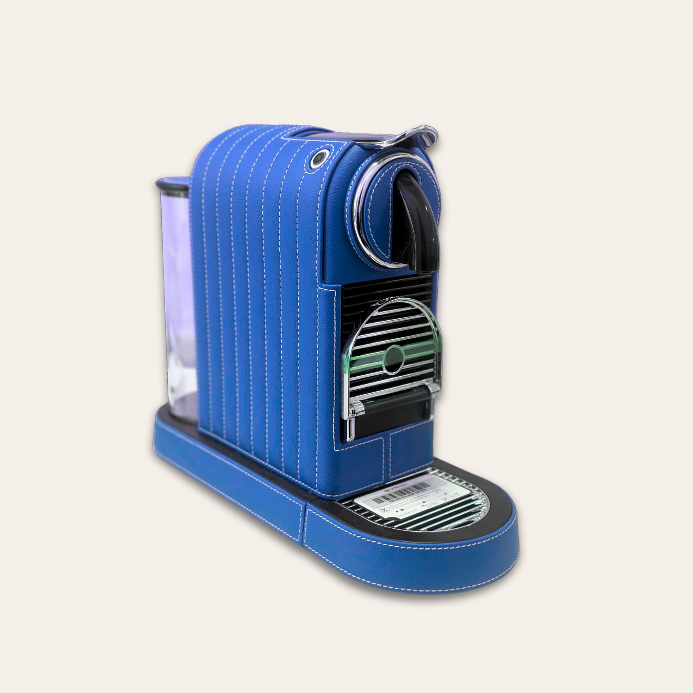 Stylish Citiz Nespresso coffee machine wrapped in luxurious vivid blue vegan leather with a straight line stitch pattern for an elegant living space