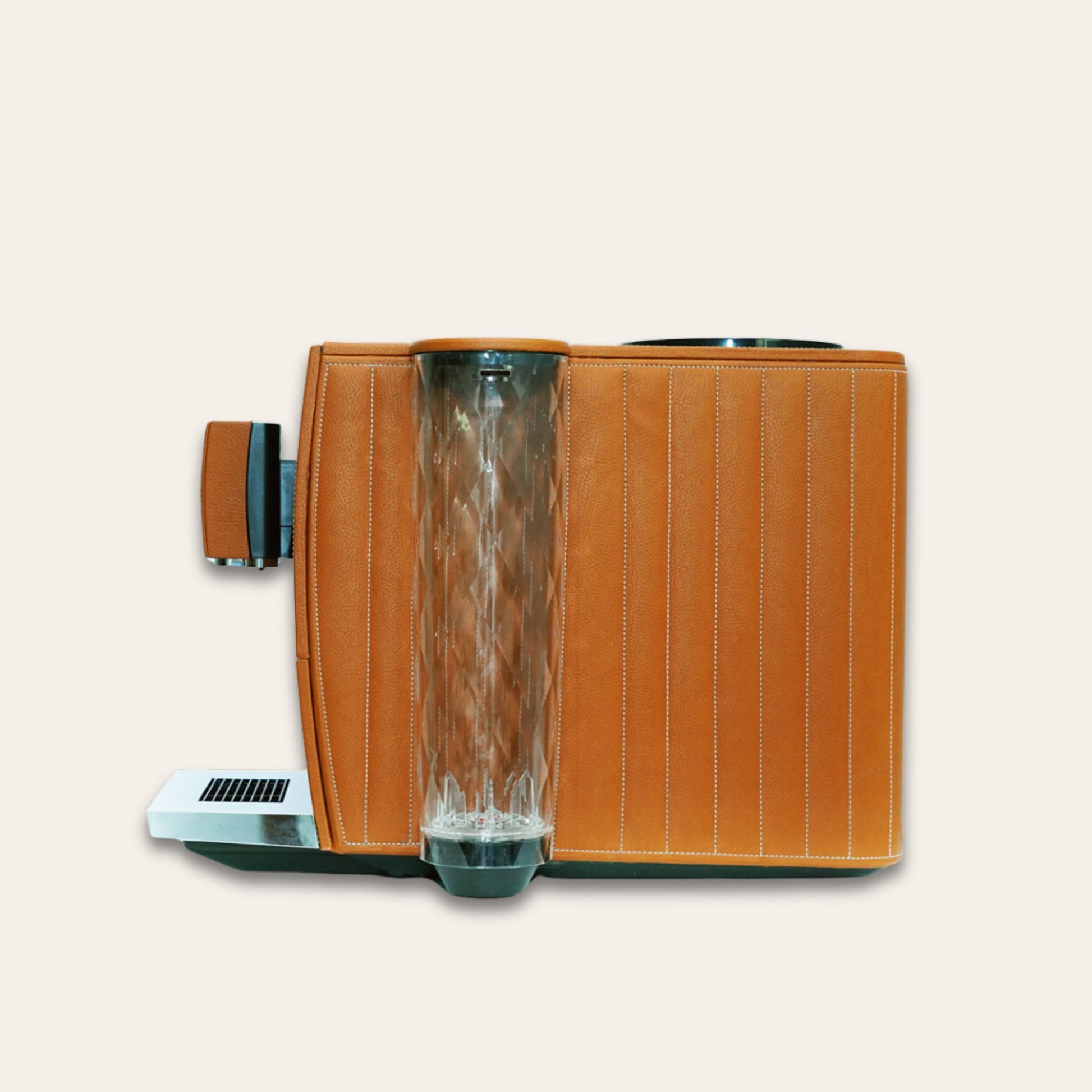 Side view showing water canister of the Jura Ena 8 luxury Coffee machine for your home. Covered in tan vegan leather - handmade in the UAE