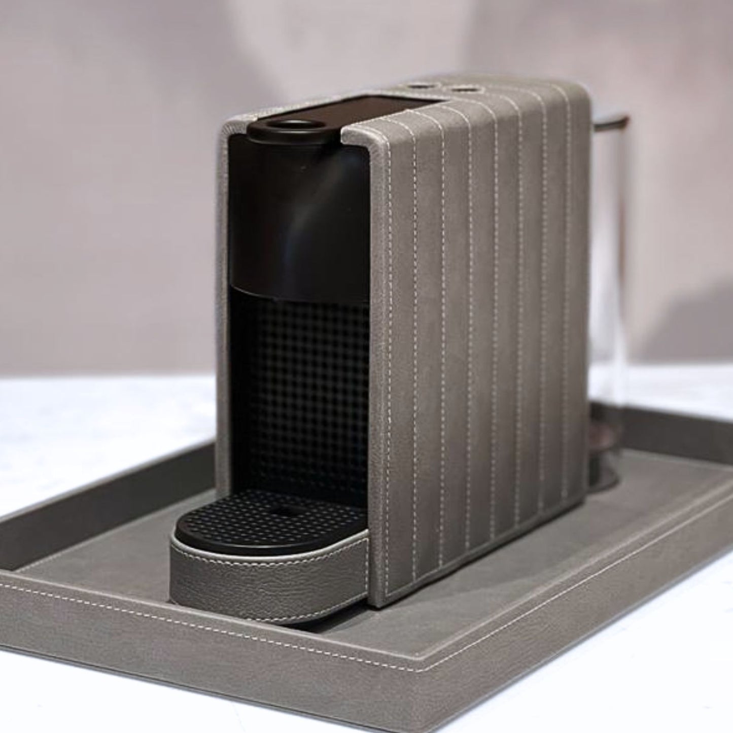 Silver grey leather finish on mini essenza nespresso coffee machine, add a touch of luxury to your space with this coffee pod maker