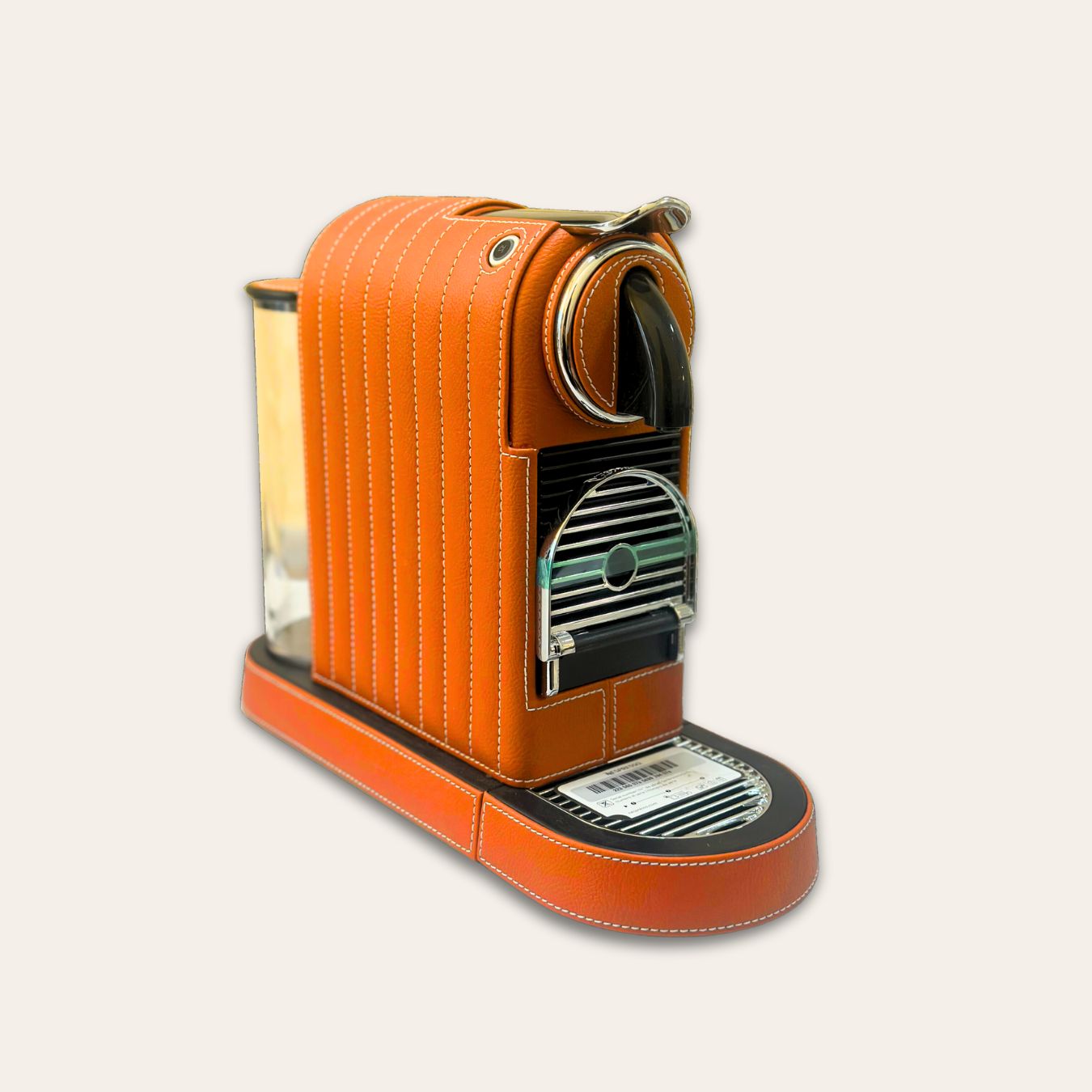 Stylish Citiz Nespresso coffee machine wrapped in a vivid orange vegan leather with a for an elegant living space