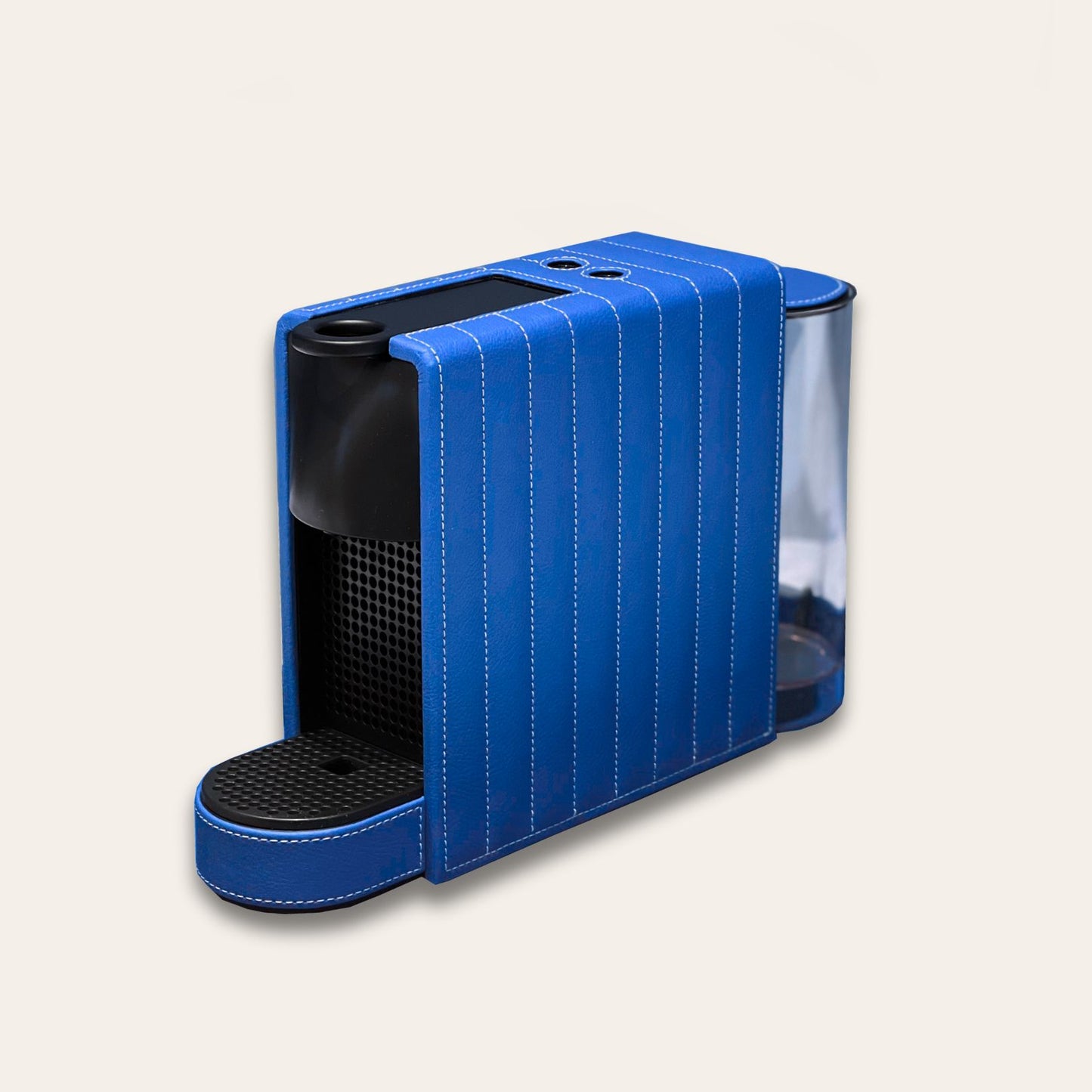 Nespresso Essenza Mini coffee machine featuring a stylish blue vegan leather covering, perfect for small spaces.