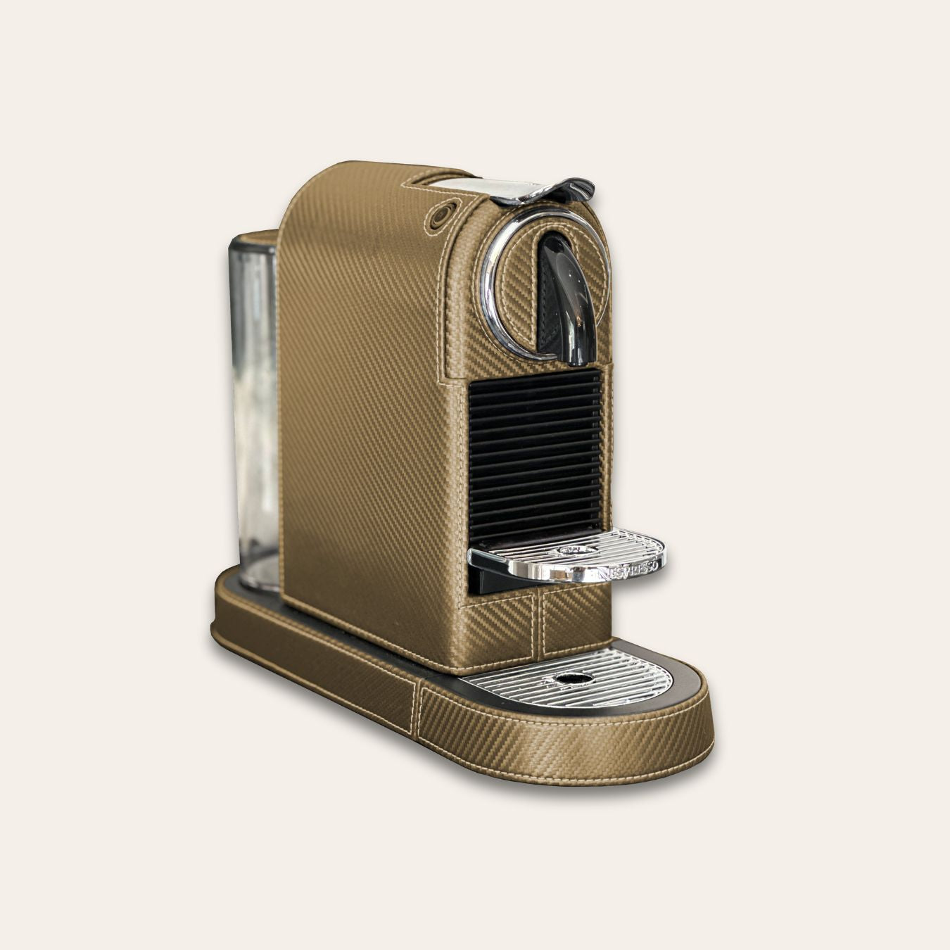 Stylish Citiz Nespresso coffee machine wrapped in a metallic golden carbon fibre effect vegan leather with a for an elegant living space