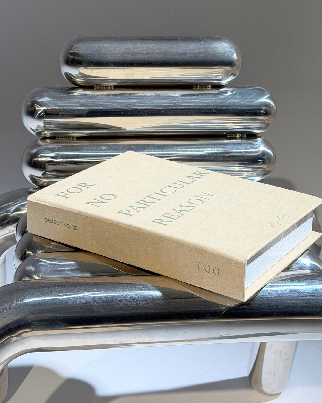 Taupe Cream decorative box with green text design on the outside
