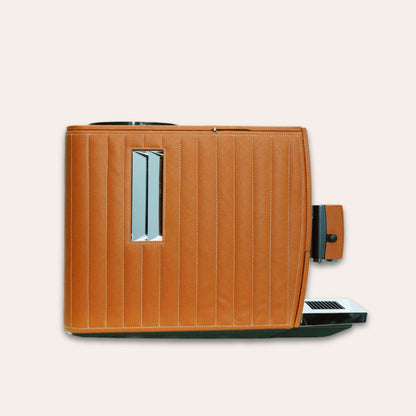 Side view of the Jura Ena 8 luxury Coffee machine for your home. Covered in tan vegan leather - handmade in the UAE