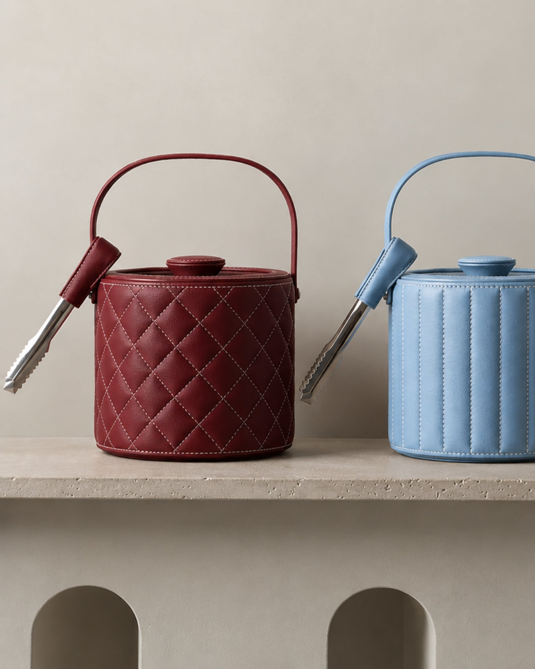 burgundy and sky blue leather wrapped ​Luxe Ice Bucket on shelf