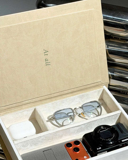 trinket box with velvet-lined compartments for watch, sunglasses and phone