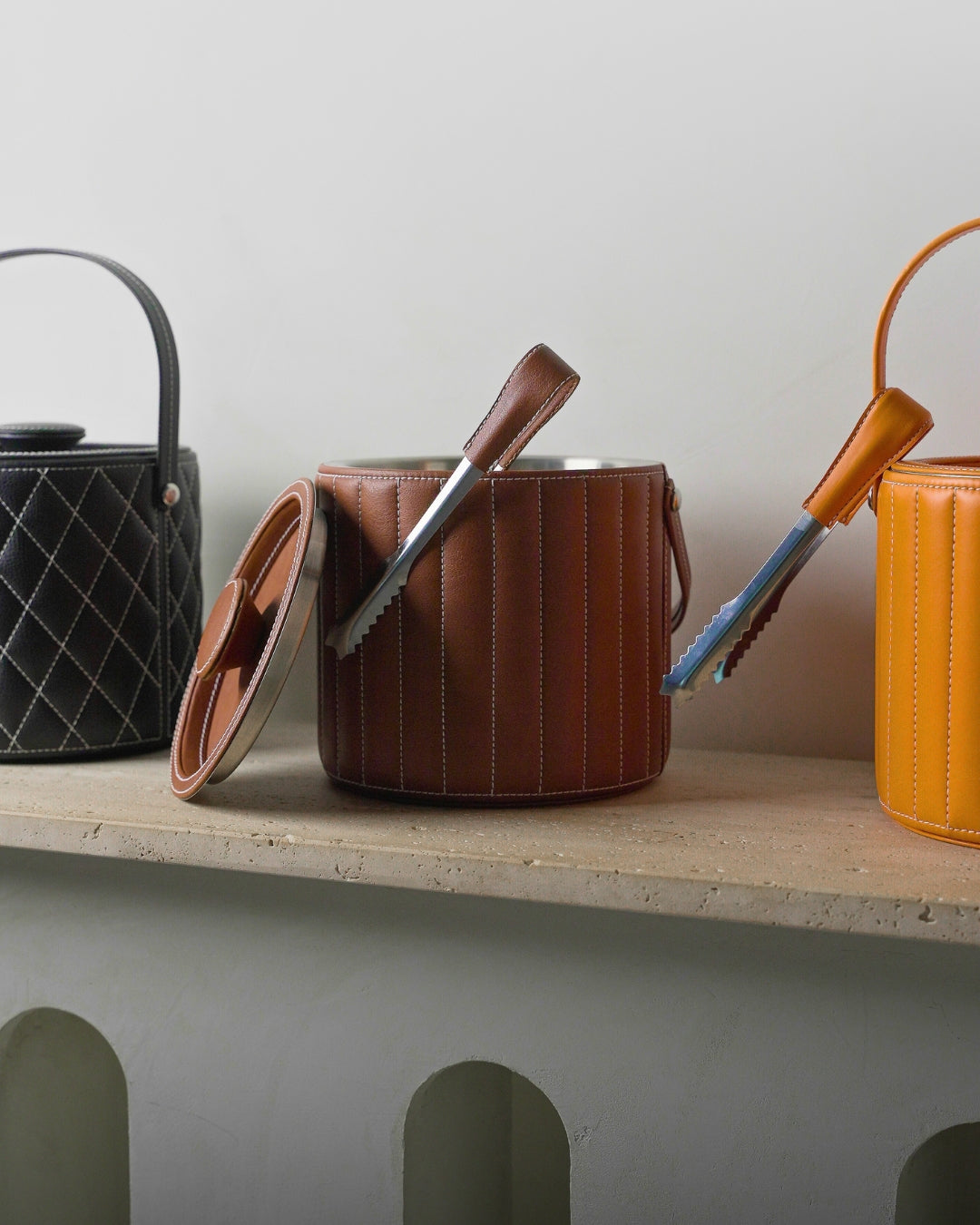 leather wrapped ​Luxe Ice Buckets on shelf